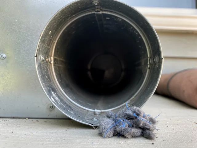 South Gate Dryer Vent Cleaning technician using specialized equipment to clear severe dryer vent blockage in South Gate